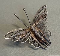 Front view showing butterfly filigree design