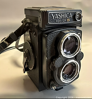 Front angled view showing twin lenses, Yashica logo, body condition