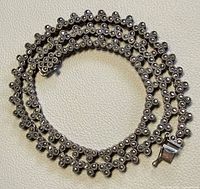 Full view coiled necklace showing overall design and clasp