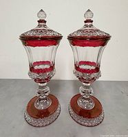 Front view of both ruby flash lidded urns