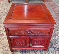 front view showing carvings, drawer, doors, hardware