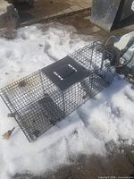 Full view of wire mesh trap showing size, material, top plate and overall condition