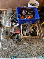 Assorted automotive parts including belts, hoses, boxed filters, ignition wire set, clamps and hardware in bins