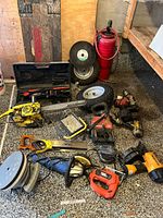 Overall view of all tools, wheels, cutting disc and accessories on floor