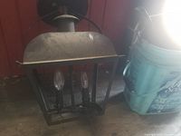 Rectangular wall lantern showing twin candelabra bulbs