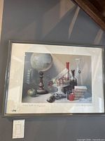 Full view of framed still-life print on wall