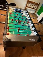 Overall view of foosball table from above showing playfield and player figures