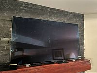 Front view of the television on stand