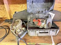 Overview showing Skil circular saw, Black & Decker router inside case