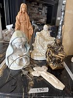 Group shot showing all statues, crucifix and pendant