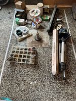Entire lot laid out showing tripod, organizer tray of fasteners, hole saws, tapes, straightedge, stand and case
