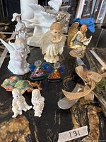 Group shot of all figurines, leaf dish, millefiori angels, bisque babies and utensils