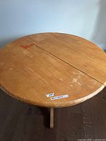 Top view of round table showing veneer surface and wear