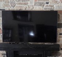 Front view of Samsung flat-screen TV on mantel stand
