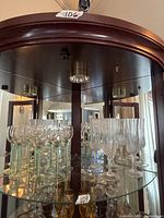 Cabinet view showing both styles of stemware in lot