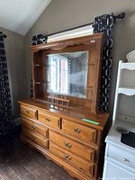 Front view of solid wood dresser with attached mirror hutch
