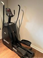 Full view of Spirit MX elliptical showing frame, pedals and handlebars