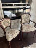 Armchair and side chair showing upholstery pattern and wood frames