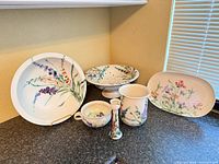 All six Clouds Folsom pottery pieces grouped together