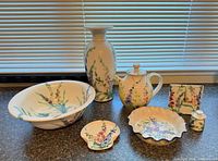 Full group shot of all seven coordinated pottery pieces