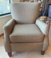 Front view of Craftmaster tweed armchair showing cushion, arms, legs