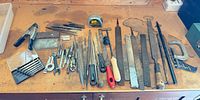 All tools laid out on workbench showing variety