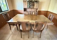 Dining table with six chairs, china cabinet in background not included