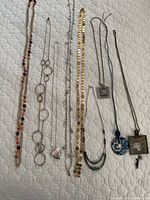 All nine necklaces laid out for full view