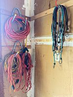 Extension cords and bungee cords hanging on hooks