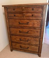 Front view showing all drawers and metal hardware