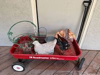 Overall lot showing red Roadmaster wagon with various decor items
