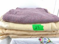 Stack of the four blankets showing colours and textures