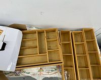 Top view of bamboo drawer organizer and three trays