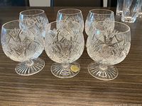 Six Bohemia lead-crystal snifter glasses displayed on table