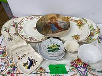 Full lot showing decorative Little Orphan Annie plate, stacks of Alfred Meakin and Grindley plates, Axe Vale bird dishes, primrose plates, cup and bowls