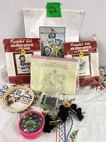 Group shot of all embroidery kits, hoop, thread holder, bobbins and floss