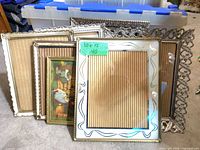 Group of six mixed metal frames showing variety and size reference