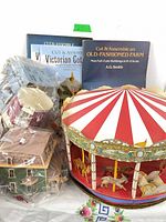 Two Dover Cut & Assemble books with bagged paper house models and assembled carousel