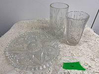 platter and two vases on table