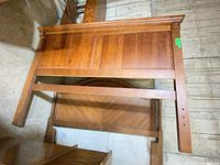 Full view of queen headboard front showing panel design and side posts