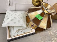Stained glass hanging lamp and two frosted glass shades grouped
