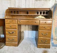 Front view of Riverside roll-top desk showing drawers, hardware, interior cubbies