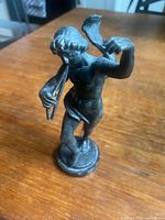 Angled front view showing figure and flutes