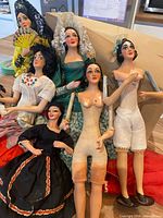 Group of six Spanish dolls showing various costumes and undressed examples
