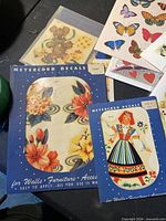 Stack of decal and sticker sheets front view