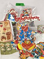 Multiple stacks of die-cut Valentine cards in clear bags, various designs visible