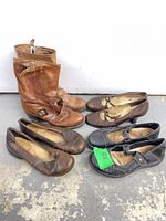 All four pairs of shoes and boots grouped together