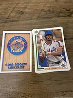 Front view of Star Rookie checklist card and D. J. Dozier rookie card from 1991 Upper Deck stack
