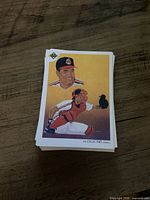 Stack of The Collectors Choice baseball art cards, top card features illustrated Cleveland Indians catcher