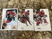 Front view of all three Ottawa Senators hockey cards